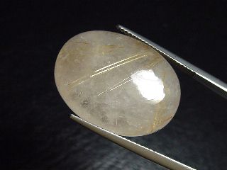 Rutile Quartz 27,81 Ct. golden Rutile needles oval cabochon