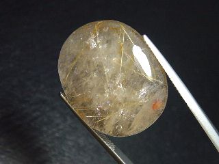Rutile Quartz 35,58 Ct. golden Rutile needles oval cabochon