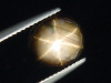 Sternsaphir 2,37 Ct. schwarz golden 10 x 9 mm Oval Cabochon