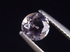 Petschite / violet Skapolite 0,43 Ct. round Tanzania